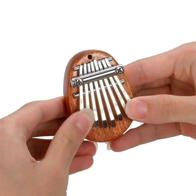 50% OFF | HarmoPalm™ - Mini Kalimba Finger Piano